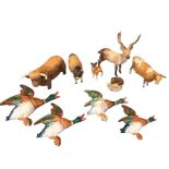 A graduated set of Beswick wall-mounting flying ducks; and seven Beswick ceramic animals - cows, a