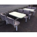 A pair of 70s cafe tables with integral rounded formica tops on tubular metal frames, each with four