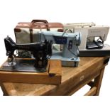 Three Singer sewing machines - 50s, 60s & 70s, two cased. (3)