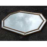 A large reproduction mirror, the octagonal bevelled plate in gilt bead moulded frame, having outer