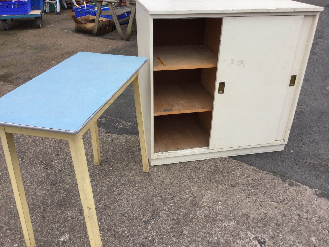 A rectangular painted cabinet with sliding doors, having brass handles enclosing shelves; and a - Image 3 of 3