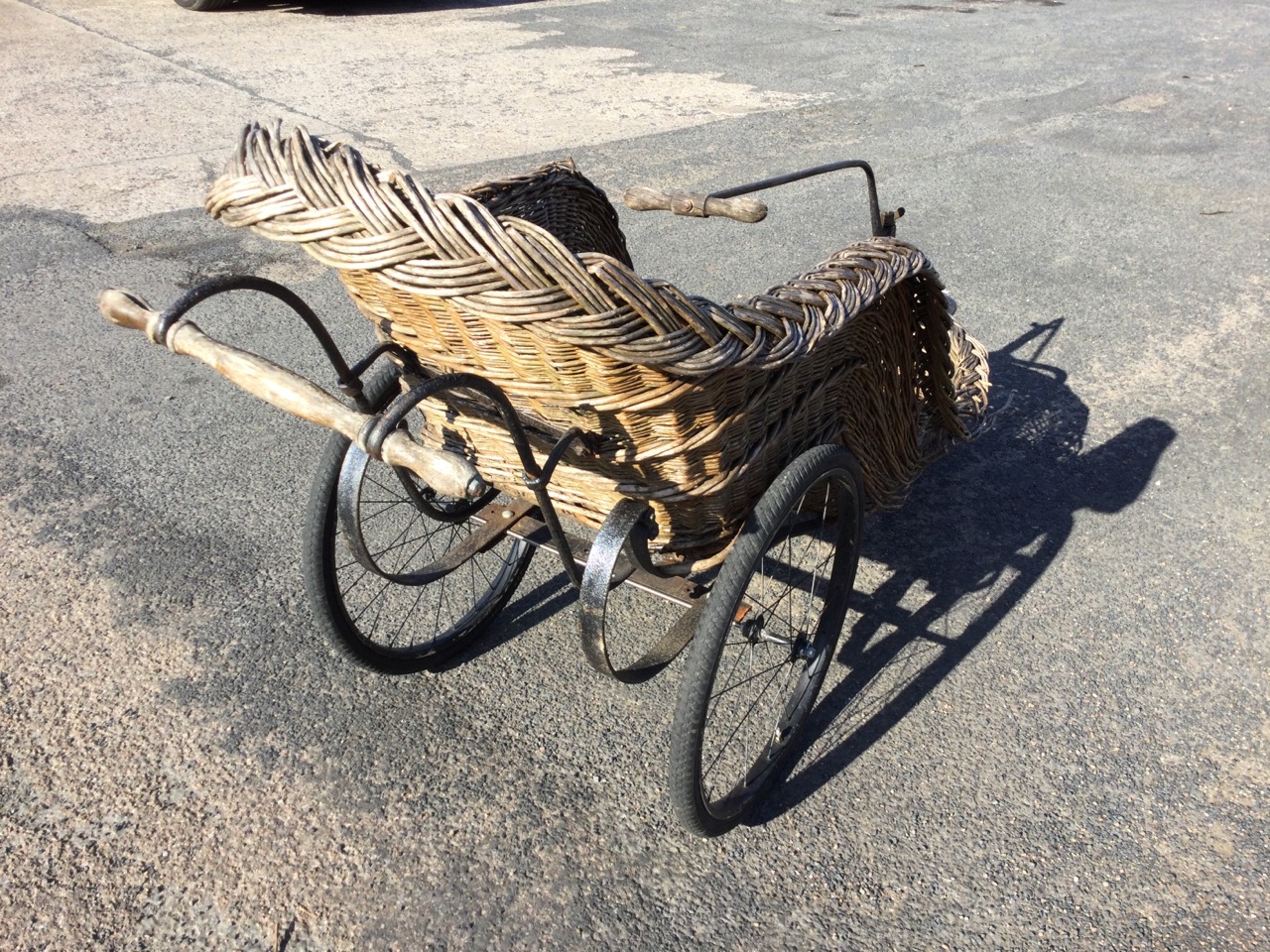 An Edwardian cane seated bath chair with sprung frame on spoked wheels, the steering mechanism - Image 3 of 3