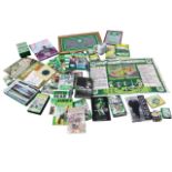 A collection of Celtic Football Club gear including books, CDs, albums, videos, mugs, a mirror, a