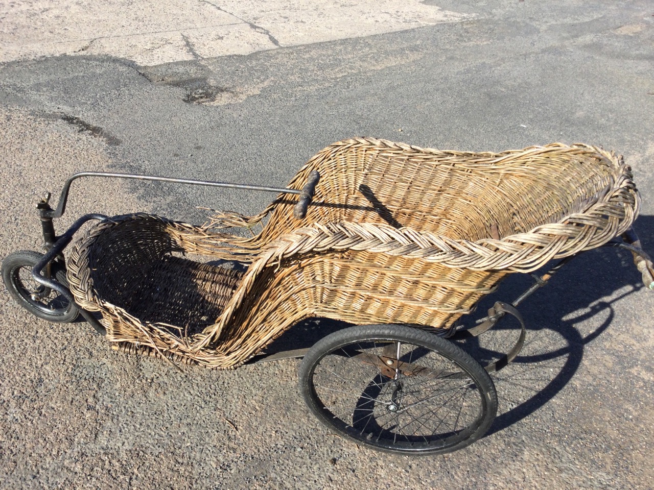 An Edwardian cane seated bath chair with sprung frame on spoked wheels, the steering mechanism - Image 2 of 3