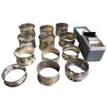 Thirteen hallmarked silver napkin rings - beaded, pierced, plain, engraved, etc. (approx 293g) (13)