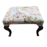 An antique George II walnut stool, with rectangular needlework upholstered seat raised on square