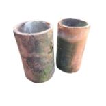 A pair of large tubular terracotta pipes - used as garden planters. (14in x 24in) (2)