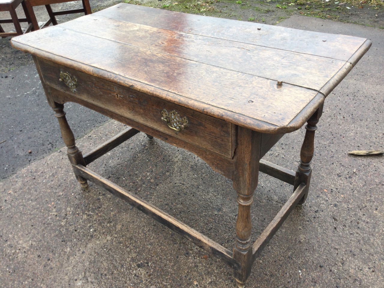 An eighteenth century oak side table with rectangular moulded three-plank top above a long frieze - Image 3 of 3