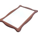 A reproduction mahogany framed mirror, the scalloped rectangular frame with satinwood crossbanding