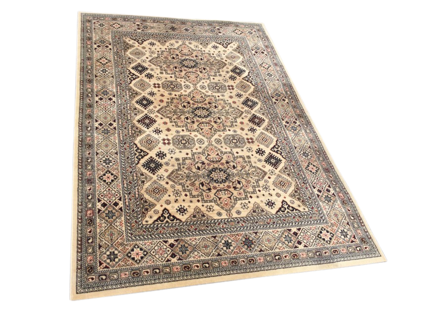 A Belgian eastern style rug woven with three oval stepped medallions on fawn field bordered to sides