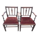 A pair nineteenth century mahogany carved elbow chairs, the rectangular backs with central fluted
