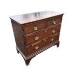 A Georgian mahogany chest of drawers with later alterations, the rectangular moulded top above two