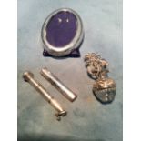 A small oval hallmarked silver photo frame; a telescopic silver cherute holder; a glass ball