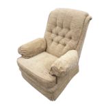 A contemporary Parker Knoll armchair with button upholstered angled back and loose cushion, raised