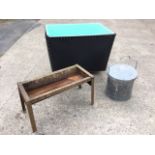 A large rectangular mill bin with fibreglass liner on four wheels; a tubular galvanised bucket