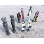 Four African tribal type figurines; a pair of Egyptian style lion vases; and a pair of blackamoor