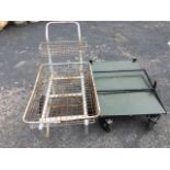 A two wheel cart with angled tubular handle mounted with two rectangular basket type cages; and