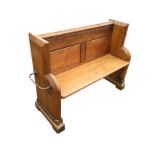 A Victorian pitch pine pew with moulded panelled back above a solid seat, the sides chamfered and