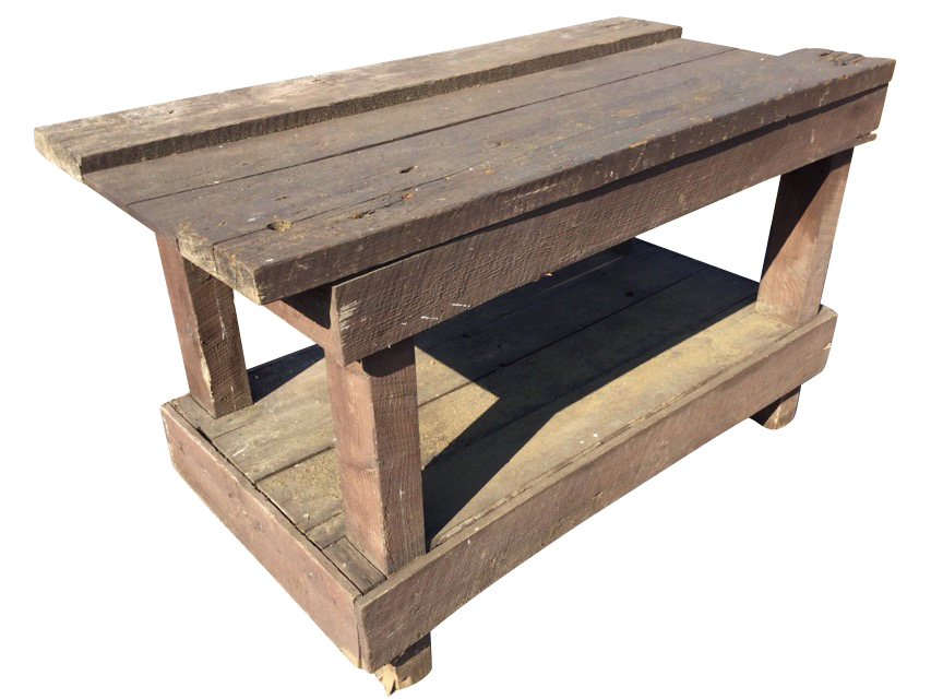 A rectangular workbench on 4in x 3in column supports, having boarded platform below. (52in x 25.75in