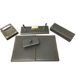 A 1950s grey leather mounted desk set with blotter, ashtray, cigarette box, pen stand, writing