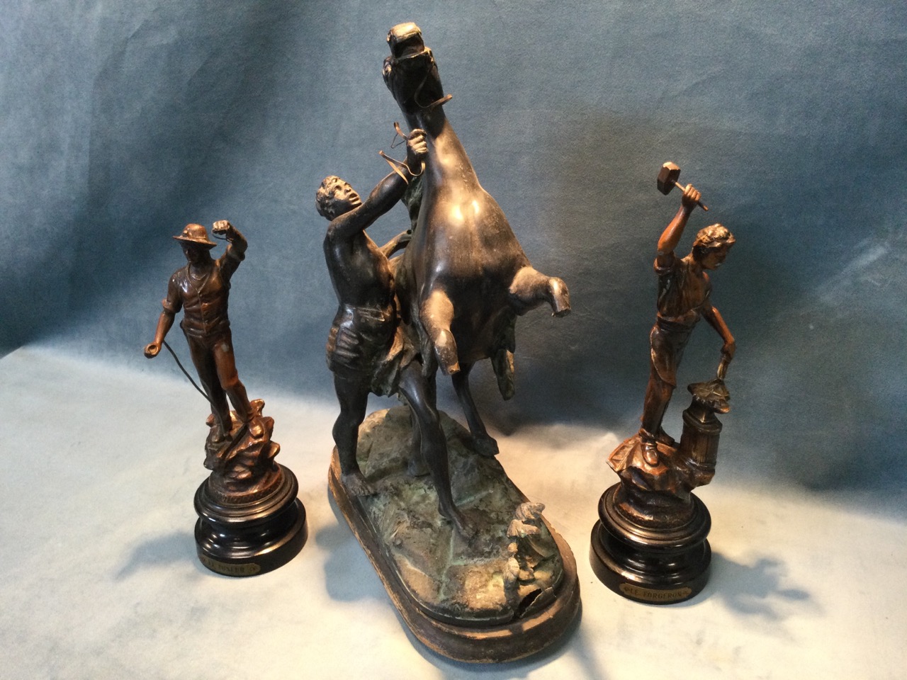 A late Victorian spelter marli horse & slave with bronze patination, raised on rectangular rounded