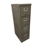 A metal filing cabinet, the four drawers having chrome handles and aluminium label holders. (15.25in