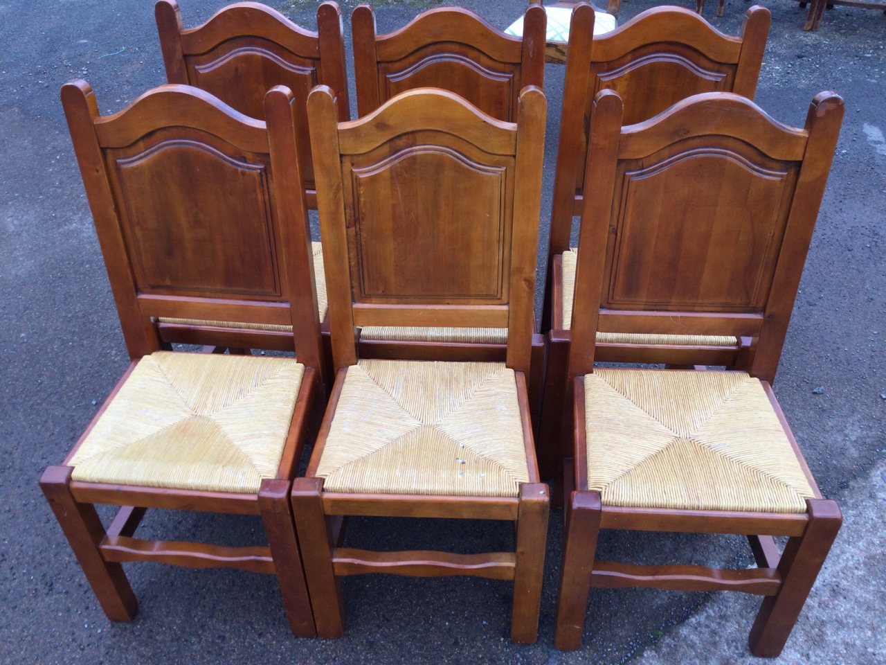 A set of six hardwood dining chairs with arched fielded panelled backs above drop-in rush seats, - Image 3 of 3