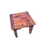 A square hardwood coffee table, the boarded top inlaid with small diamond shaped panels, raised on