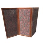 A late Victorian mahogany framed screen with rule-jointed brass hinges, the three panels upholstered