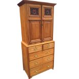 A married Victorian satin walnut press cupboard, with moulded cornice above two scroll carved and