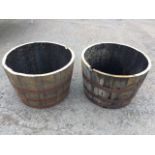 A pair of circular oak garden tubs, the staves each bound by three rivetted strap bands. (25.75in