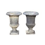 A pair of large resin moulded lead type campana urns, with overhanging rims on fluted bodies with