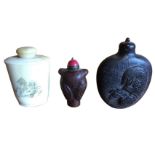 A tapering carved soapstone type snuff bottle with red ceramic stopper having brass mounts;
