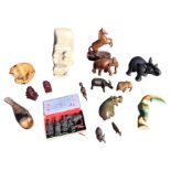 Miscellaneous carved and moulded animals including a stone hippo, elephants, dogs of fo, boxed