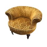 A Victorian mahogany tub armchair, the rounded upholstered back above a circular sprung seat, raised