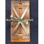 A rectangular Harrods mahogany clothes press, the moulded boards having chromed cast iron mounts,