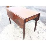 A rectangular nineteenth century mahogany pembroke table, the rectangular top with two rule-