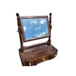 A George IV mahogany dressing table mirror, the rectangular plate in cushion moulded frame on ring-