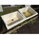 Two rectangular butlers sinks, the angled fronts with cushion moulding, one cemented up to be a