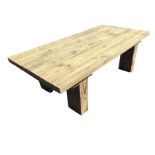 A rectangular garden coffee table with plank top on block legs. (44in x 21in x 13.75in)