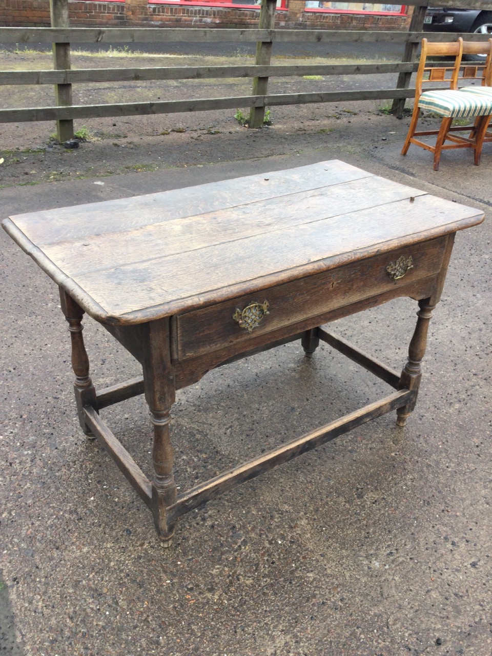 An eighteenth century oak side table with rectangular moulded three-plank top above a long frieze - Image 2 of 3