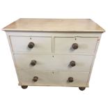 A Victorian painted pine chest of drawers with rectangular moulded top above two short and two