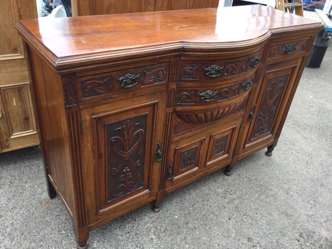 A Victorian carved walnut sideboard, the bowfronted central section with two drawers above a - Image 3 of 3