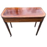 A nineteenth century turn-over-top mahogany card table, the rounded satinwood crossbanded top having