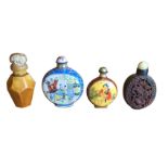 Two enamelled metal moonflask shaped snuff bottles with floral borders; a hexagonal amber type