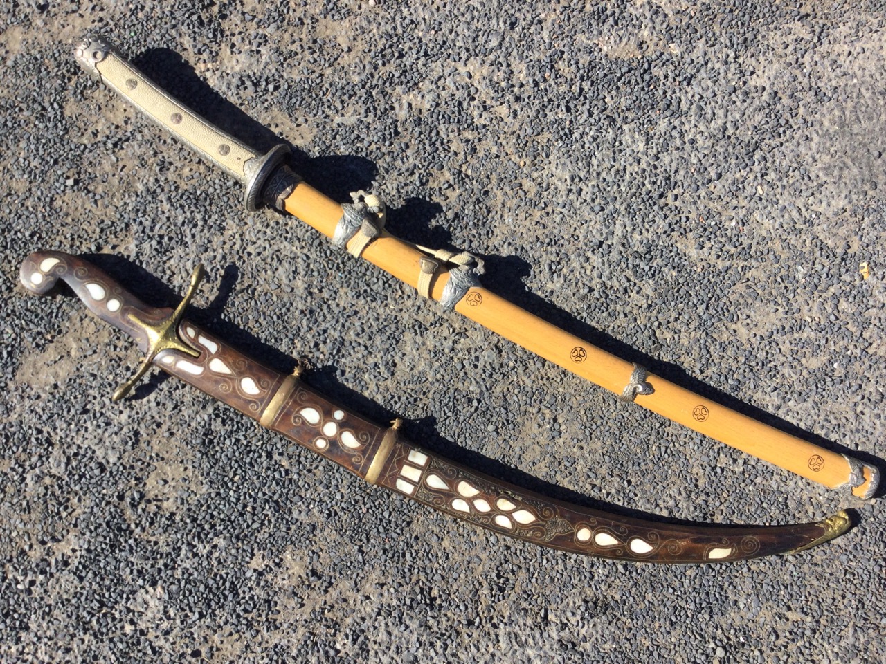 A Japanese Katana sword with silver plated mounts, the handle with shagreen type panel having