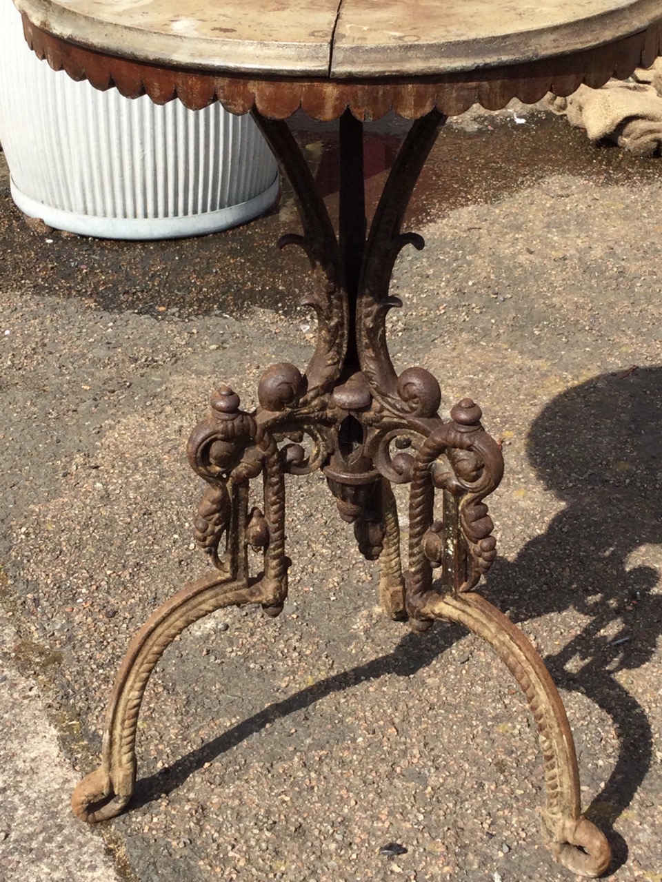 A circular Victorian cast iron table with ropetwist cast tripod legs centered by a scrolled urn, the - Image 3 of 3