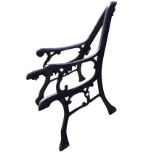 A pair of cast iron bench ends, the channelled frames with scrolled decoration with scrolled arms,