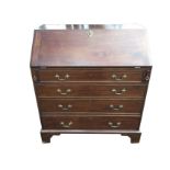 A George III mahogany bureau, the fallfront revealing a fitted interior with small drawers and