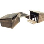 Two tongue & grooved chicken nest boxes with pitched roofs, and a boarded rectangular run with